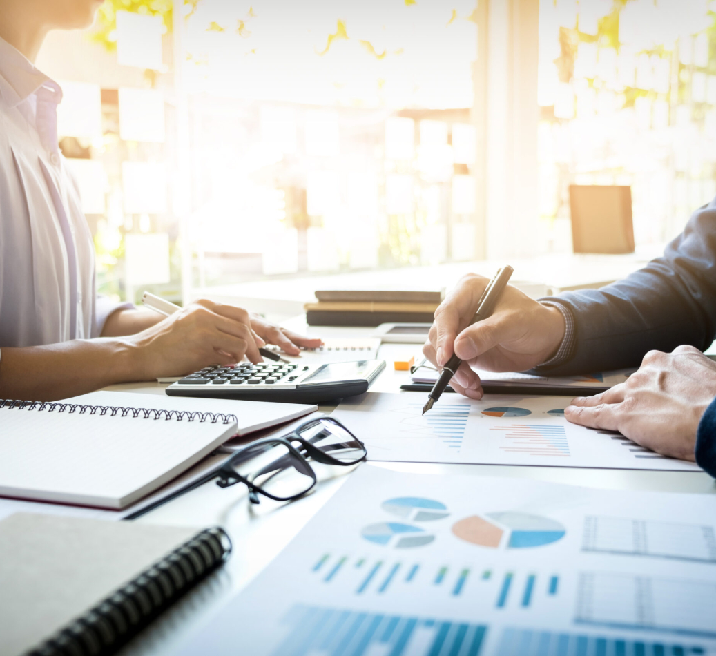 business man financial inspector and secretary making report, calculating or checking balance. Internal Revenue Service inspector checking document. Audit concept