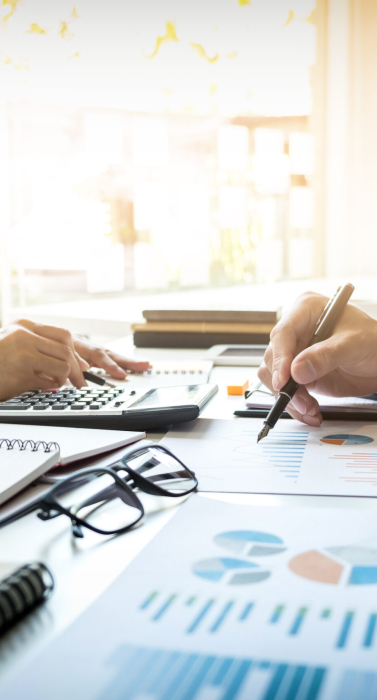 business man financial inspector and secretary making report, calculating or checking balance. Internal Revenue Service inspector checking document. Audit concept